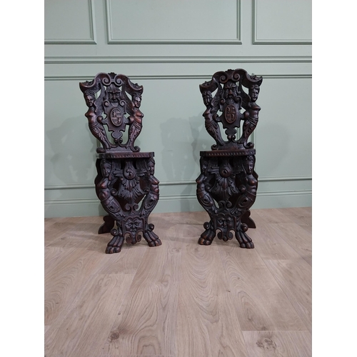 780 - Pair of 19th C.  carved walnut armorial hall chairs  {100 cm H x 40 cm W x 40 cm D}.