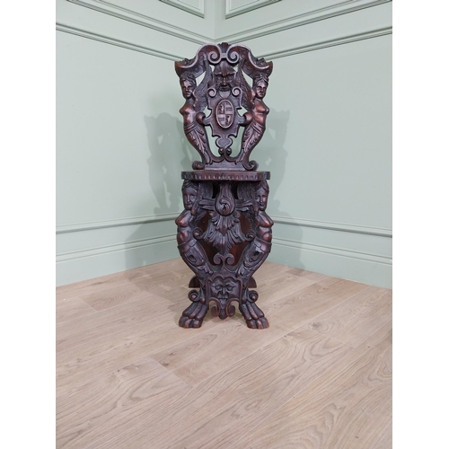 780 - Pair of 19th C.  carved walnut armorial hall chairs  {100 cm H x 40 cm W x 40 cm D}.