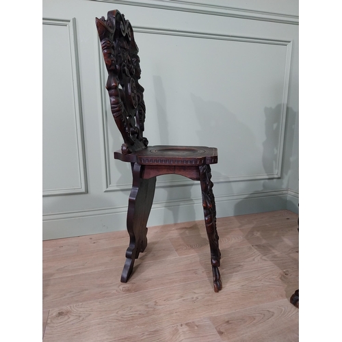 780 - Pair of 19th C.  carved walnut armorial hall chairs  {100 cm H x 40 cm W x 40 cm D}.