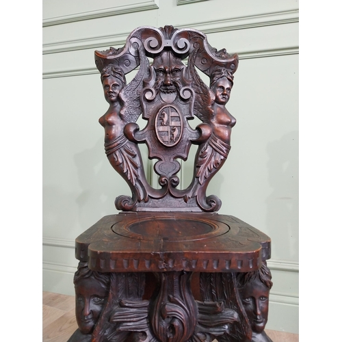 780 - Pair of 19th C.  carved walnut armorial hall chairs  {100 cm H x 40 cm W x 40 cm D}.