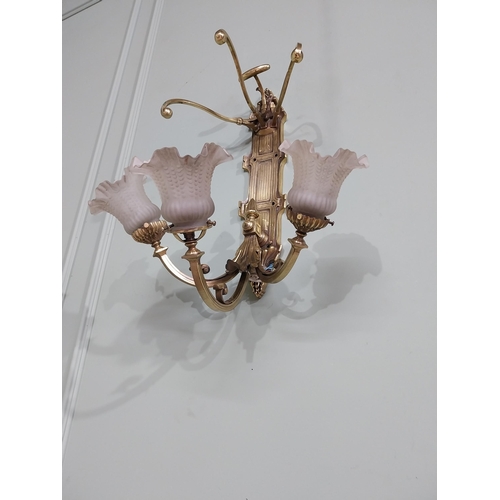 785 - Edwardian brass wall light with three tulip glass shades {55 cm H x 47 cm W x 39 cm D}.