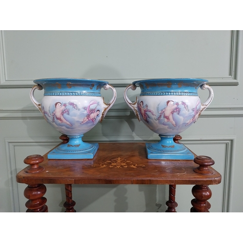 791 - Pair of good quality French hand painted ceramic jardinières decorated with Cherubs and swags {24 cm... 