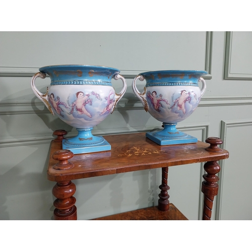 791 - Pair of good quality French hand painted ceramic jardinières decorated with Cherubs and swags {24 cm... 