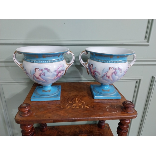 791 - Pair of good quality French hand painted ceramic jardinières decorated with Cherubs and swags {24 cm... 