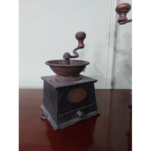 793 - Two early 20th C. cast iron and brass coffee grinders {27 cm H x 21 cm W x 14 cm D AND 20 cm H x 15 ... 