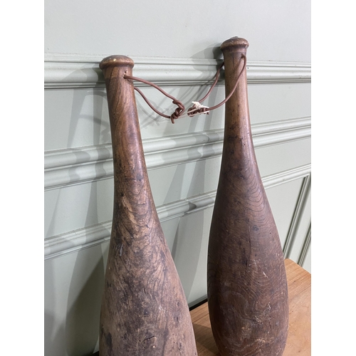 796 - Pair of 19th C. yew wood exercise dumbbells {64 cm H and 60 cm H}.