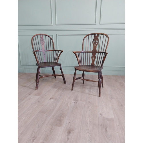 799 - Two 19th C. ash and elm Windsor arm chairs raised on turned legs and single stretchers {105 cm H x 6... 