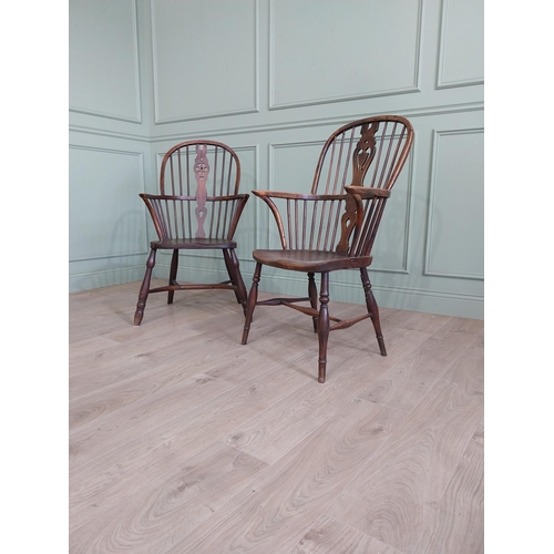 799 - Two 19th C. ash and elm Windsor arm chairs raised on turned legs and single stretchers {105 cm H x 6... 