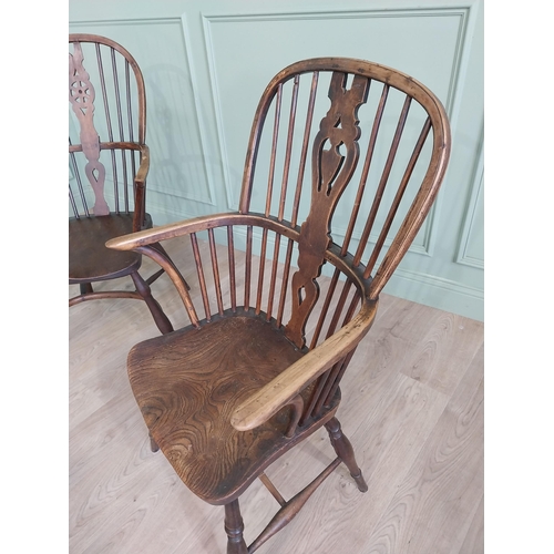 799 - Two 19th C. ash and elm Windsor arm chairs raised on turned legs and single stretchers {105 cm H x 6... 