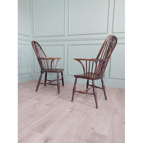 799 - Two 19th C. ash and elm Windsor arm chairs raised on turned legs and single stretchers {105 cm H x 6... 