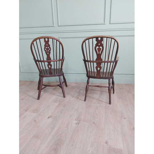 799 - Two 19th C. ash and elm Windsor arm chairs raised on turned legs and single stretchers {105 cm H x 6... 