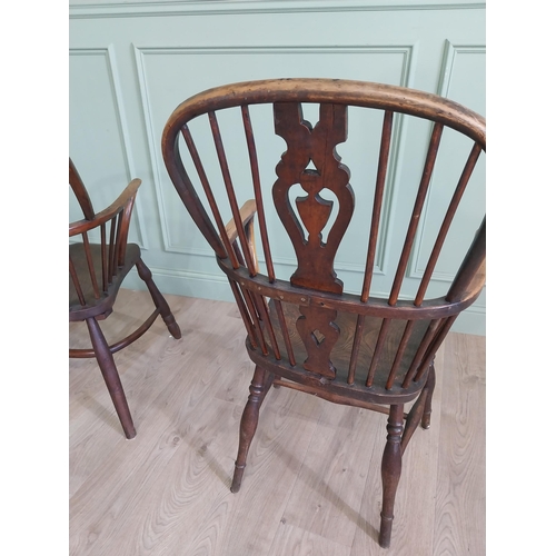 799 - Two 19th C. ash and elm Windsor arm chairs raised on turned legs and single stretchers {105 cm H x 6... 