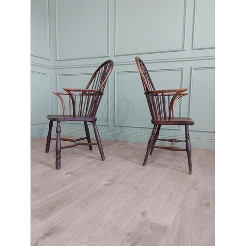 799 - Two 19th C. ash and elm Windsor arm chairs raised on turned legs and single stretchers {105 cm H x 6... 