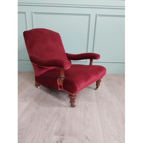 800 - 19th C. Jones of Dublin upholstered easy chair raised on oak reeded legs and brass castors {80 cm H ... 