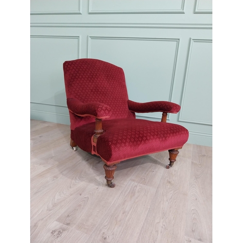 800 - 19th C. Jones of Dublin upholstered easy chair raised on oak reeded legs and brass castors {80 cm H ... 