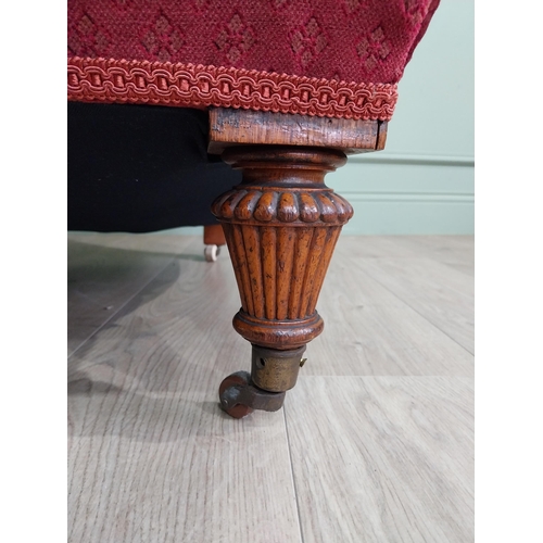 800 - 19th C. Jones of Dublin upholstered easy chair raised on oak reeded legs and brass castors {80 cm H ... 