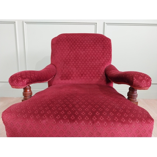 801 - 19th C. mahogany upholstered easy chair raised on turned legs and brass castors in the Howard and so... 