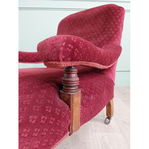 801 - 19th C. mahogany upholstered easy chair raised on turned legs and brass castors in the Howard and so... 