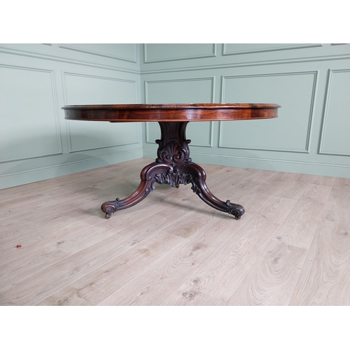 81 - Exceptional quality 19th C. rosewood centre table raised on profusely carved central pod and three o... 