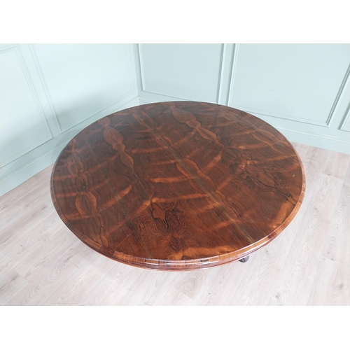 81 - Exceptional quality 19th C. rosewood centre table raised on profusely carved central pod and three o... 