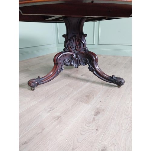 81 - Exceptional quality 19th C. rosewood centre table raised on profusely carved central pod and three o... 