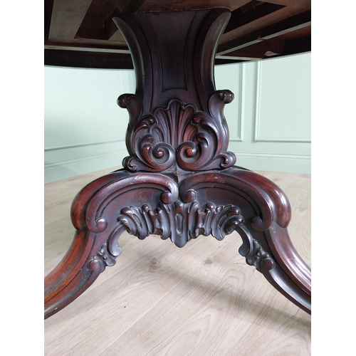 81 - Exceptional quality 19th C. rosewood centre table raised on profusely carved central pod and three o... 