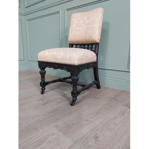 819 - Edwardian ebonised and upholstered chair raised on turned legs {92 cm H x 52 cm W x 64 cm D}.