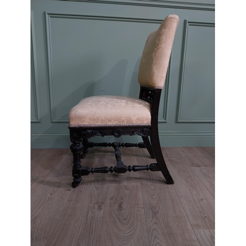 819 - Edwardian ebonised and upholstered chair raised on turned legs {92 cm H x 52 cm W x 64 cm D}.