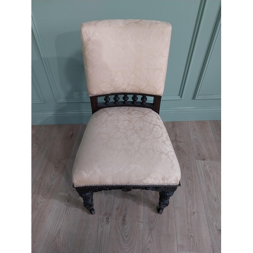 819 - Edwardian ebonised and upholstered chair raised on turned legs {92 cm H x 52 cm W x 64 cm D}.