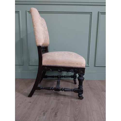 819 - Edwardian ebonised and upholstered chair raised on turned legs {92 cm H x 52 cm W x 64 cm D}.