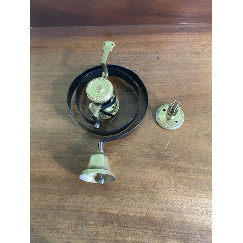 82 - Brass and wrought iron house bell {25 cm H x 16 cm W x 10 cm D}.