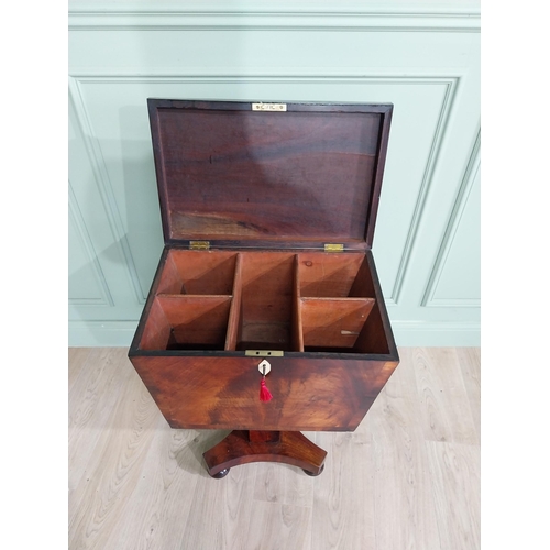 831 - Georgian flamed mahogany cellarette with fitted interior raised on square column and platform base {... 