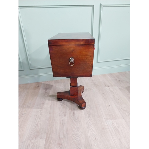 831 - Georgian flamed mahogany cellarette with fitted interior raised on square column and platform base {... 