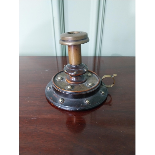 839 - Early 20th C. brass and mahogany thumb candle holder {9 cm H x 11 cm Dia.}.