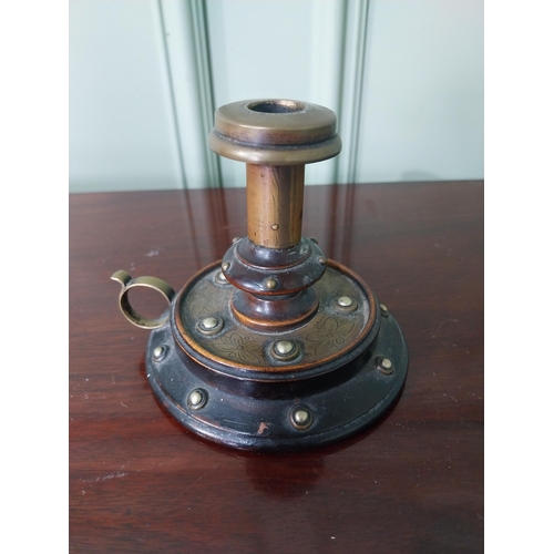 839 - Early 20th C. brass and mahogany thumb candle holder {9 cm H x 11 cm Dia.}.