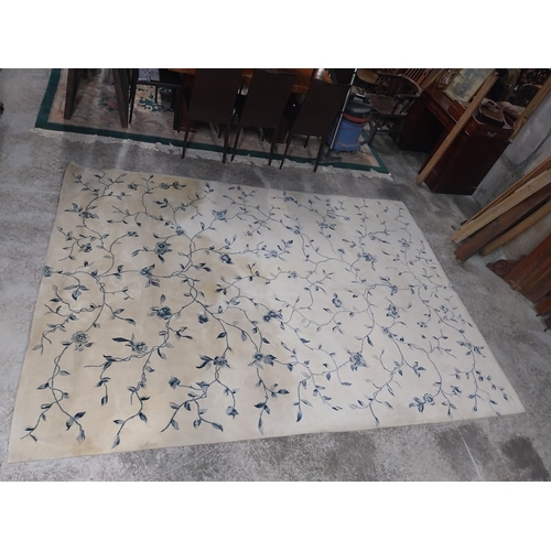 849 - Carpet square decorated with flowers {332 cm L x 239 cm W}.