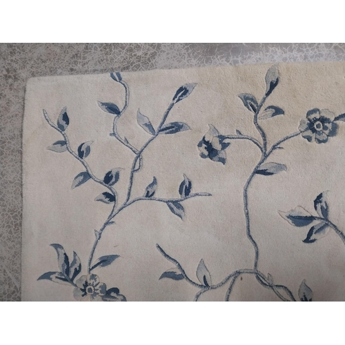 849 - Carpet square decorated with flowers {332 cm L x 239 cm W}.