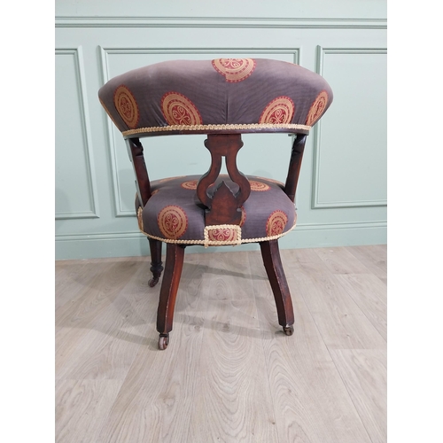 855 - Victorian mahogany and upholstered armchair raised on turned legs and brass castors {78 cm H x 77 cm... 