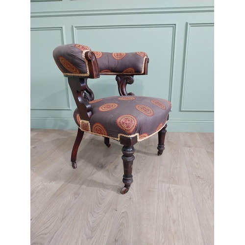 855 - Victorian mahogany and upholstered armchair raised on turned legs and brass castors {78 cm H x 77 cm... 