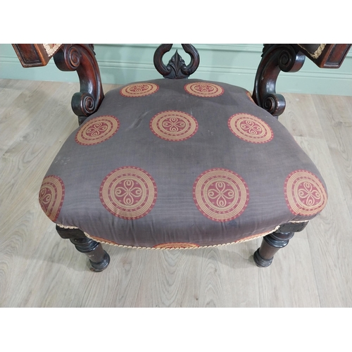 855 - Victorian mahogany and upholstered armchair raised on turned legs and brass castors {78 cm H x 77 cm... 