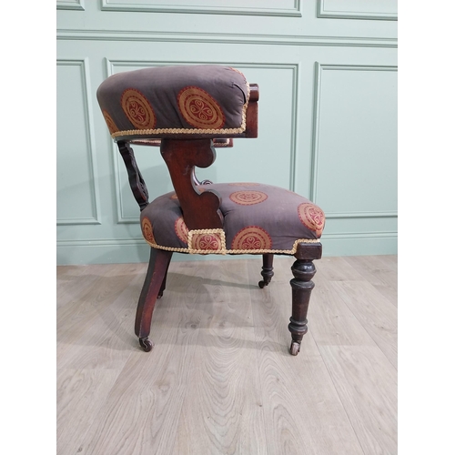 855 - Victorian mahogany and upholstered armchair raised on turned legs and brass castors {78 cm H x 77 cm... 