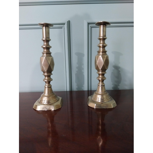 87 - Pair of Victorian brass candlesticks stamped The Diamond Prince {31 cm H x 11 cm Dia.}.