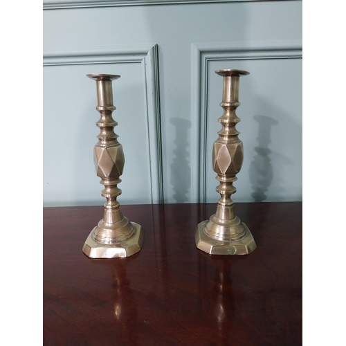 87 - Pair of Victorian brass candlesticks stamped The Diamond Prince {31 cm H x 11 cm Dia.}.