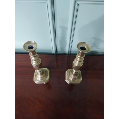 87 - Pair of Victorian brass candlesticks stamped The Diamond Prince {31 cm H x 11 cm Dia.}.