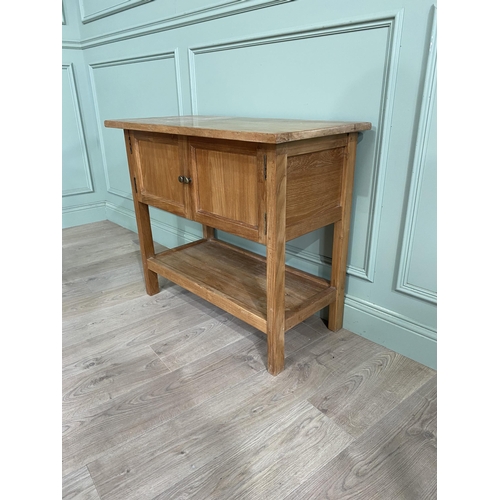 871 - Good quality oak side cabinet with two blind doors above single drawers raised on square legs {79 cm... 