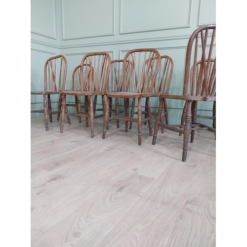 874 - Set of eight ash and elm kitchen chairs raised on turned legs {91 cm H x 37 cm W  x 45 cm D}.