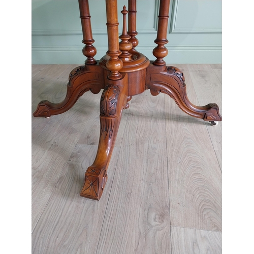 88 - Good quality Victorian burr walnut tilt top oval centre table raised on four columns, four out swept... 