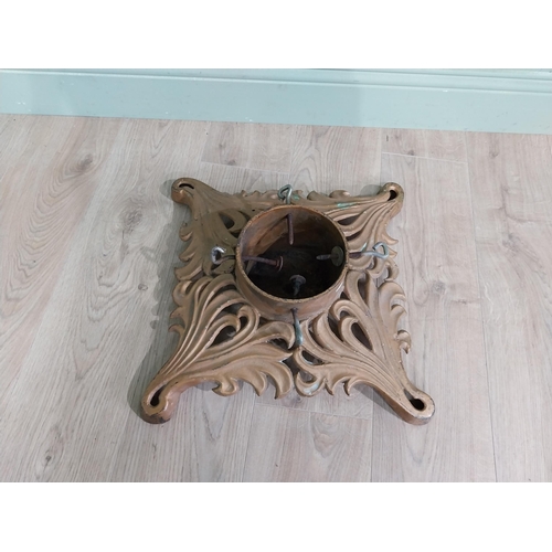 881 - Decorative cast iron Christmas tree stand {14 cm H x 44 cm W x 44 cm D}.