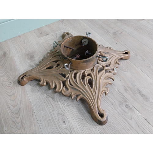 881 - Decorative cast iron Christmas tree stand {14 cm H x 44 cm W x 44 cm D}.