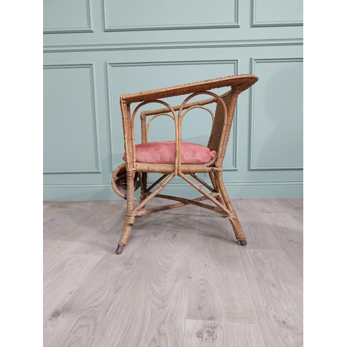 891 - 1950s wicker chair with cushion {73 cm H x 64 cm W x 64 cm D}.